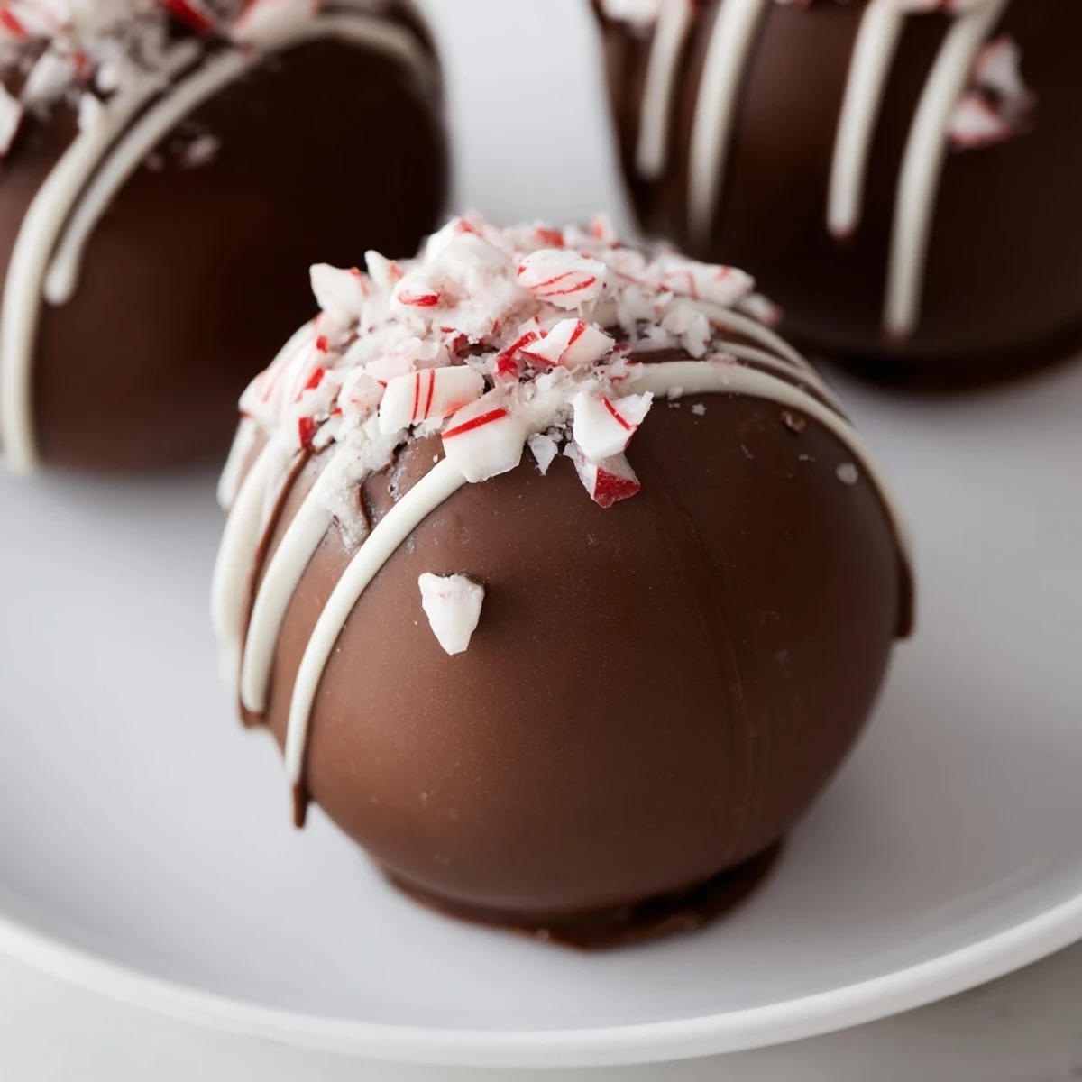 A decadent Peppermint Hot Cocoa Bomb, ready to release rich chocolate flavor into warm milk.