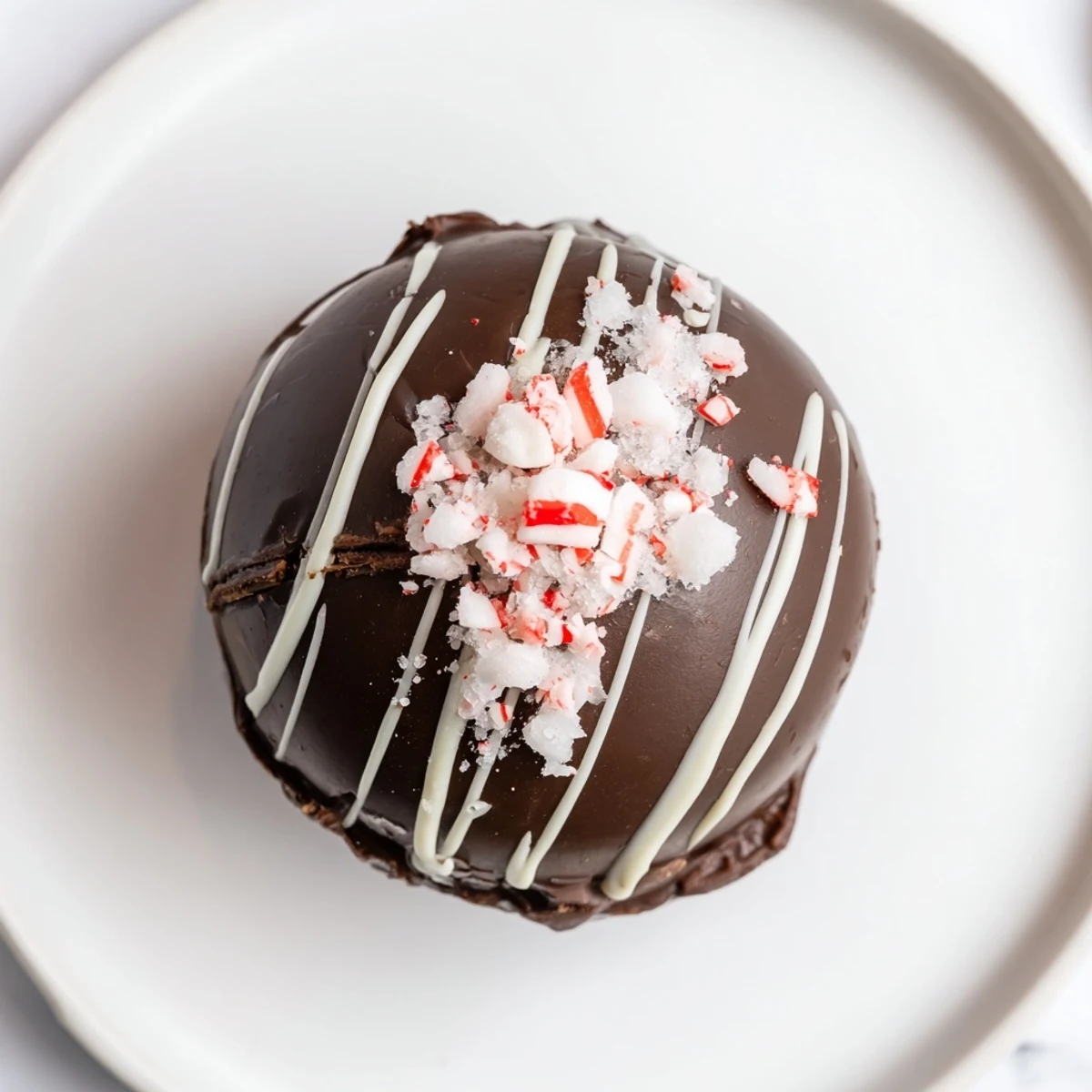 Perfectly round Peppermint Hot Cocoa Bombs sprinkled with crushed peppermint and ready to melt.