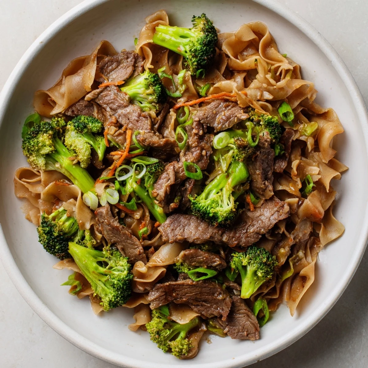 Steaming Beef and Broccoli Noodles, a delightful weeknight meal with tender beef and vibrant vegetables.