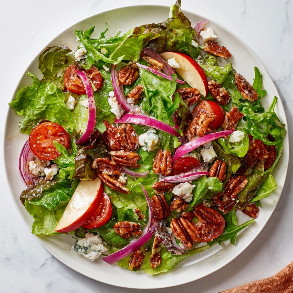 This satisfying Pecan Salad features crisp apple slices and crunchy pecans, perfect for lunch.
