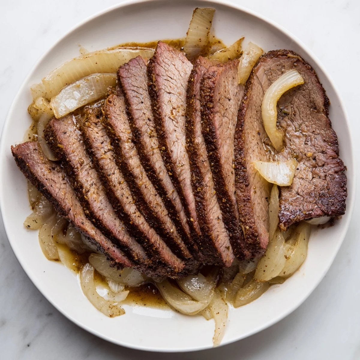 A close-up of tender, juicy beef brisket, with a rich, savory crust, ready to serve.