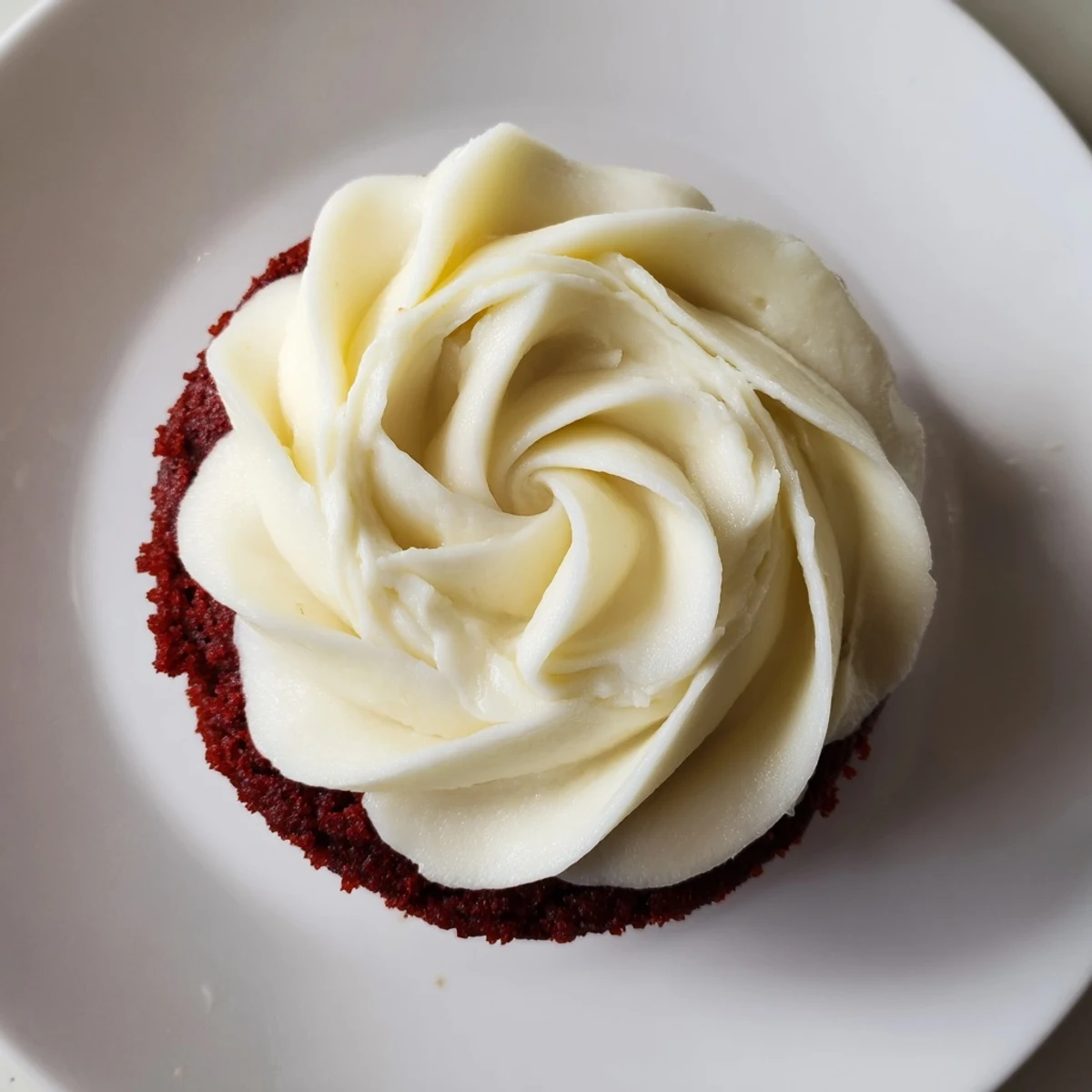Fluffy, red velvet cupcakes with creamy frosting, a perfect centerpiece for dessert.