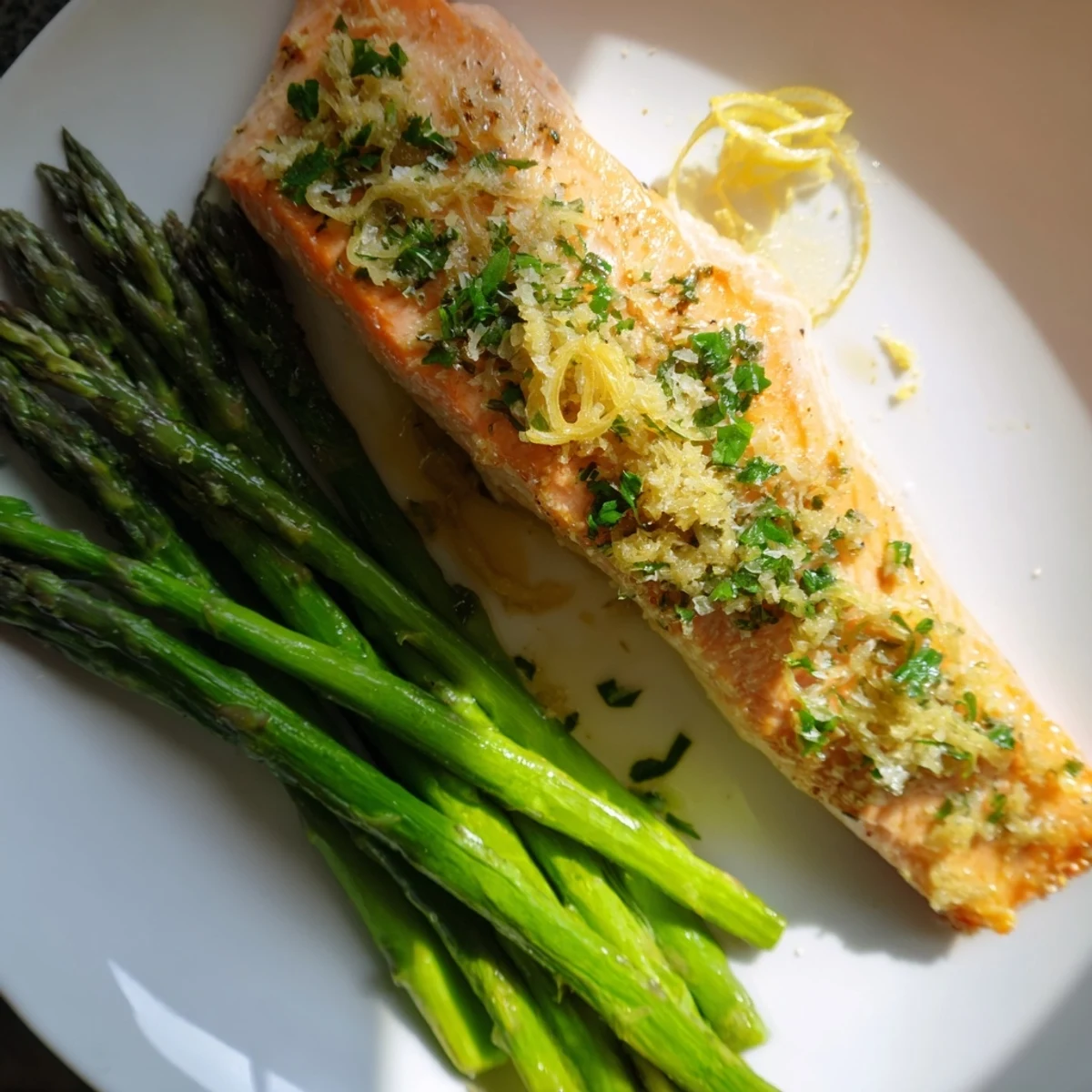 Juicy Lemon Garlic Butter Salmon with tender asparagus, ready for a flavor-packed, healthy dinner.