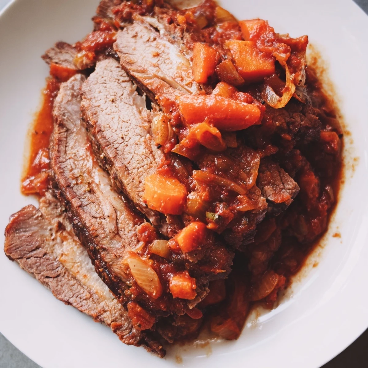 Beef Brisket with Sauce emerges from the Dutch oven, steam rising from saucy, slow-cooked slices.