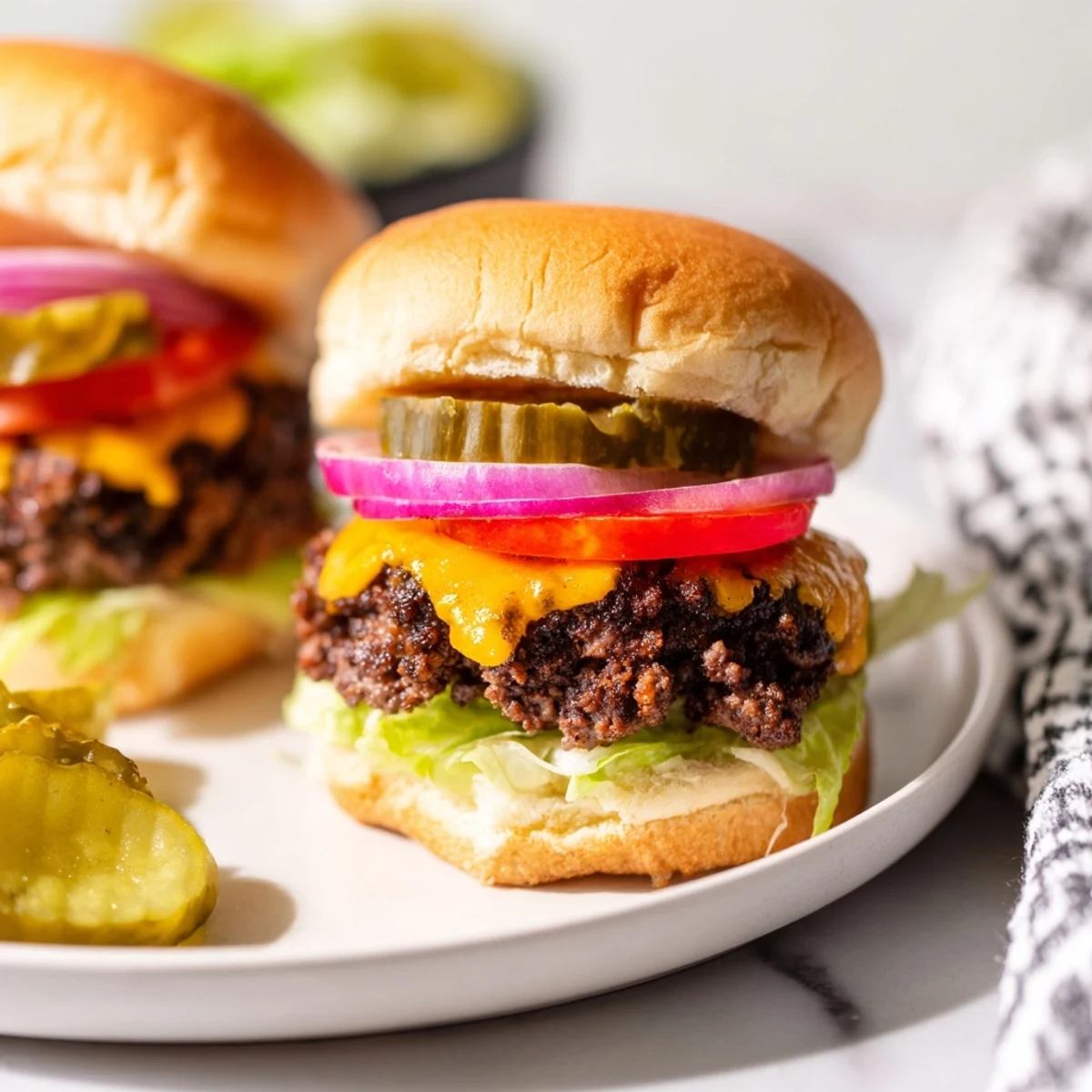 Freshly assembled Beef Sliders with Cheddar Cheese feature seasoned beef patties and colorful toppings, ideal for easy weeknight dinners.