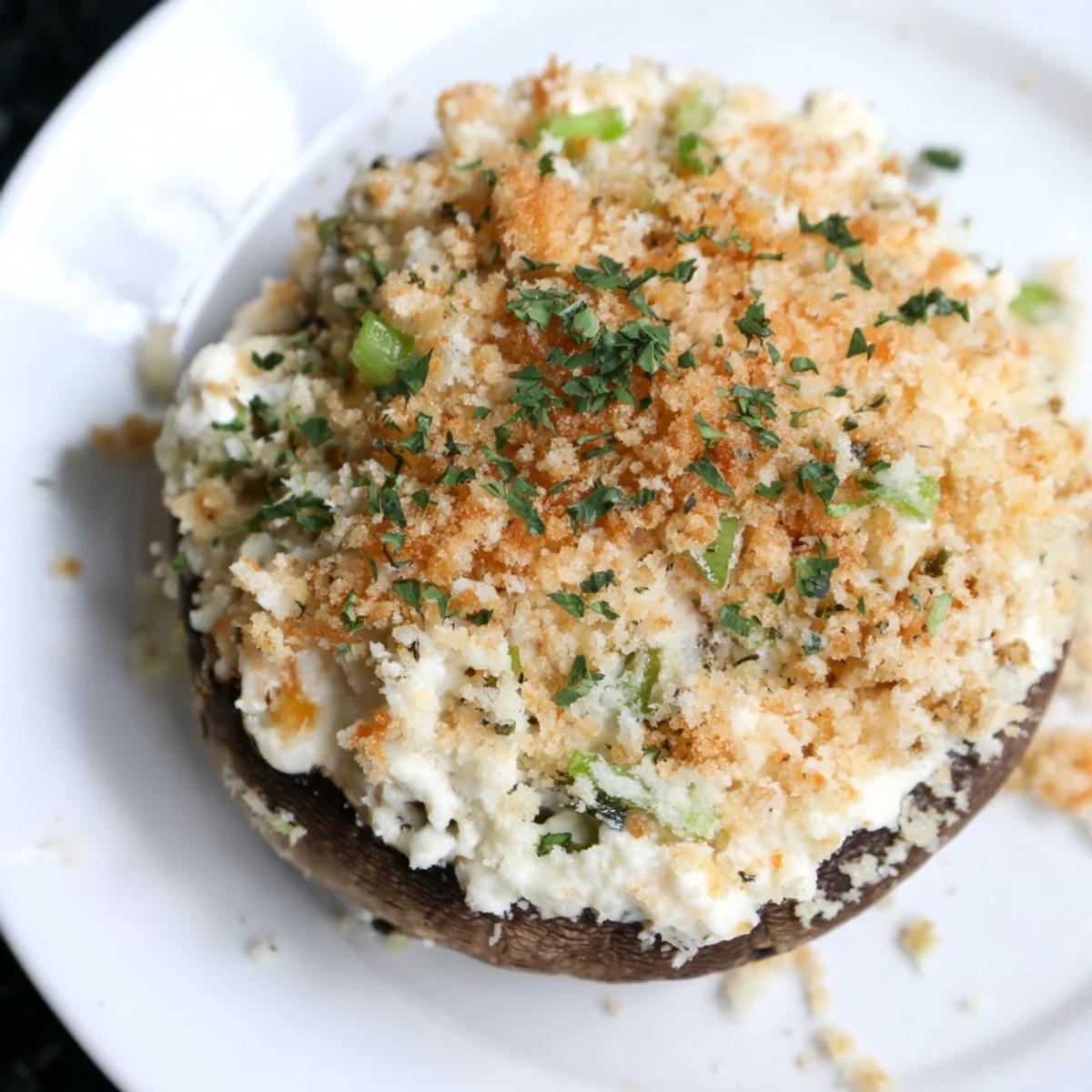 Golden-baked mozzarella popper stuffed mushrooms with cheddar and spices, served warm as a crowd-pleasing vegetarian appetizer.