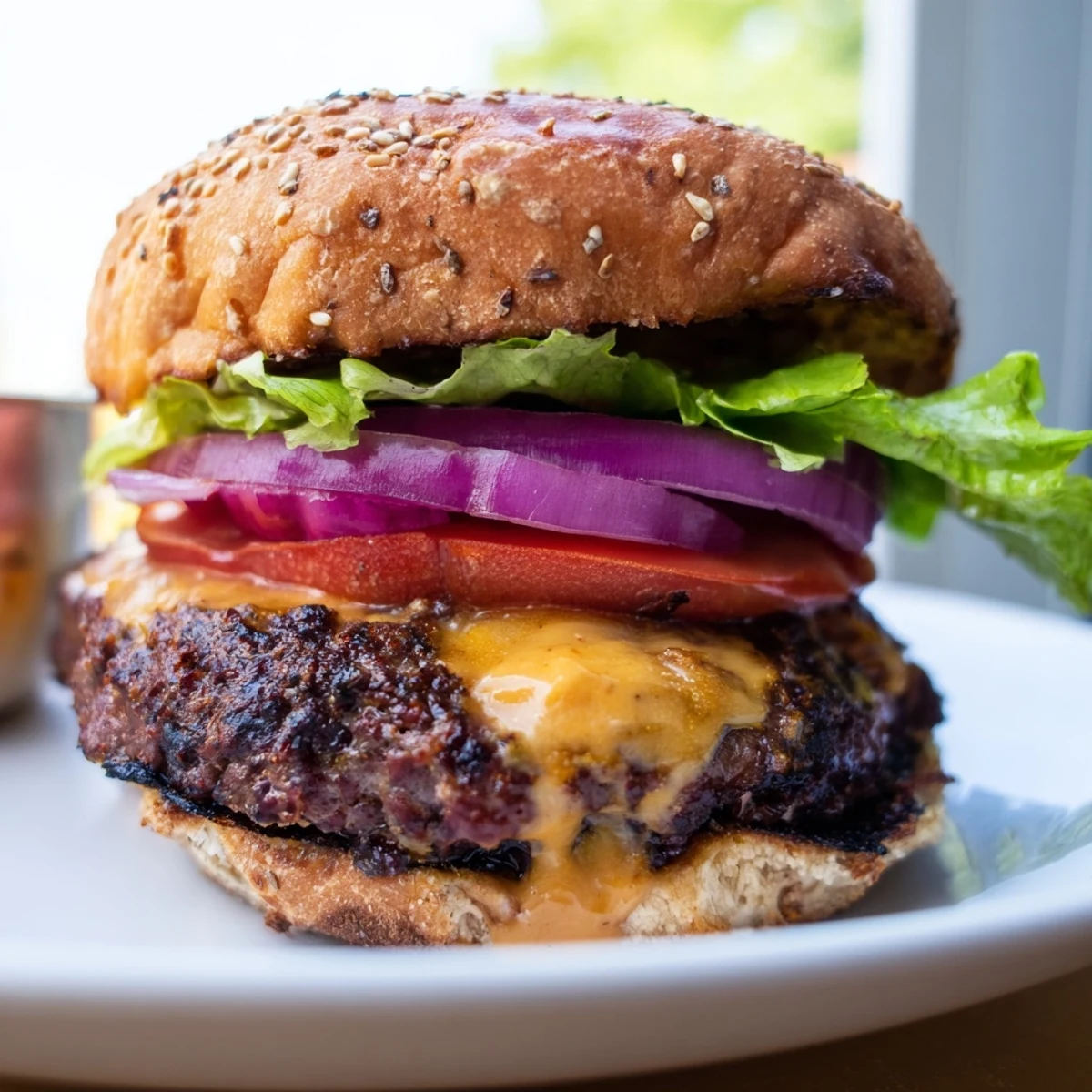 Classic smash burger stacked high with fresh lettuce tomato and melted cheese