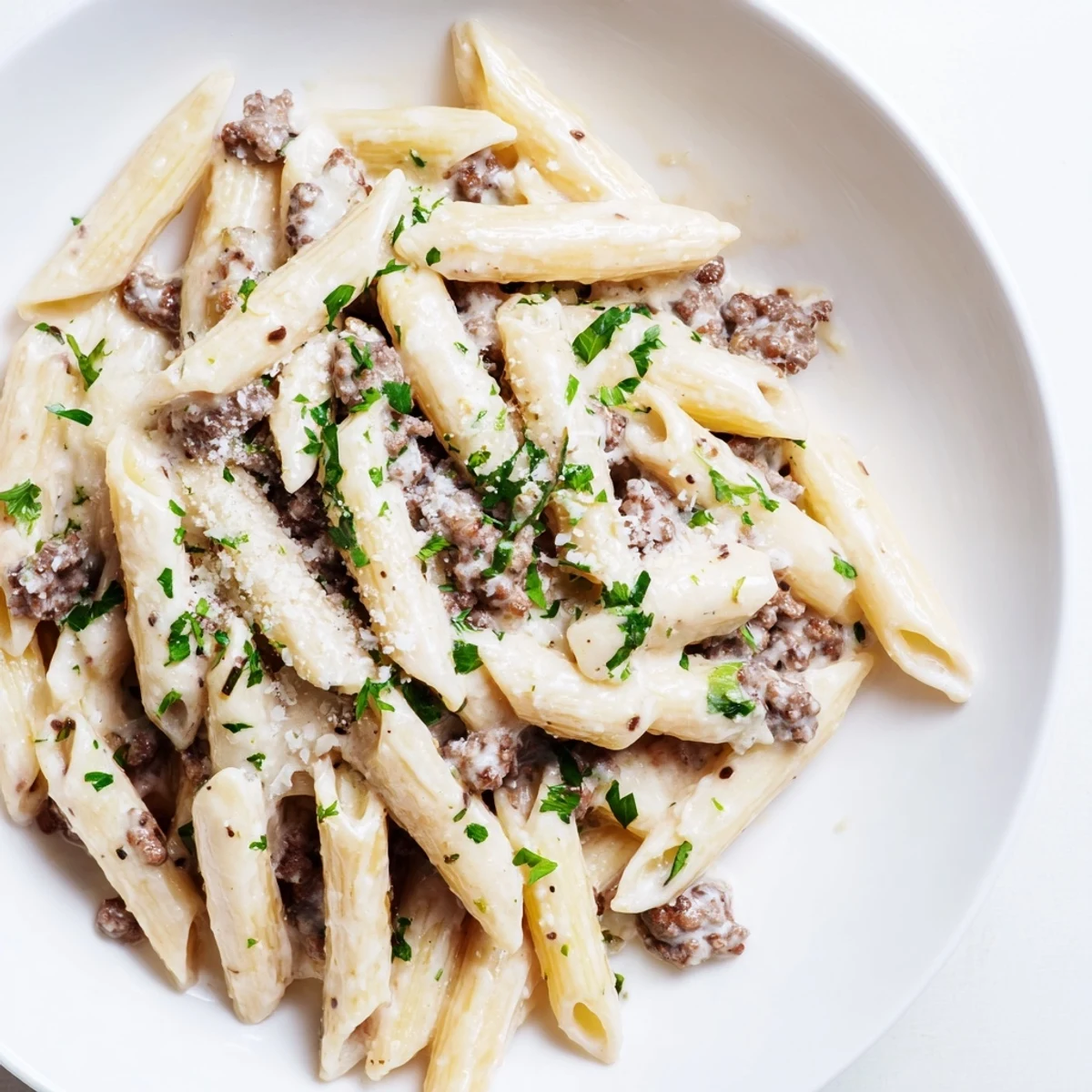 Savory ground beef pasta tossed in velvety cream sauce perfect for family dinner