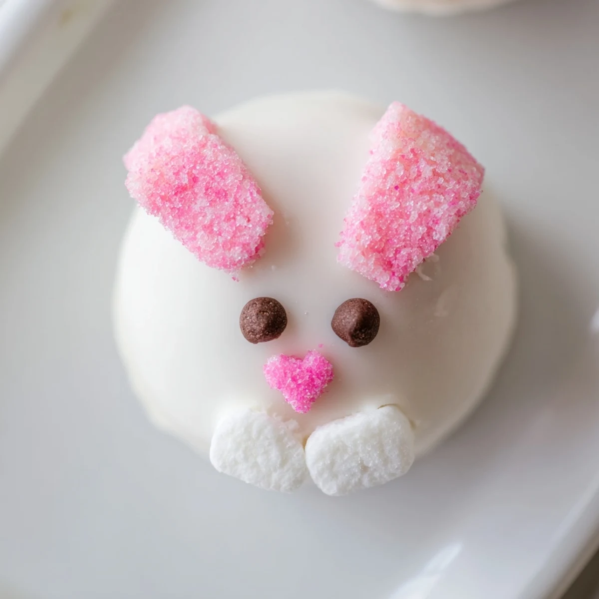 Adorable bunny Oreo balls dipped in smooth white chocolate with pink marshmallow ears and cute faces