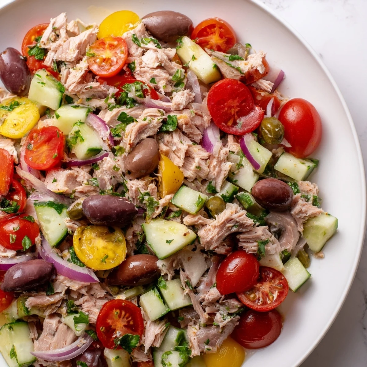 Simple Mediterranean Tuna Salad tossed with capers, herbs, and a zesty olive oil vinaigrette