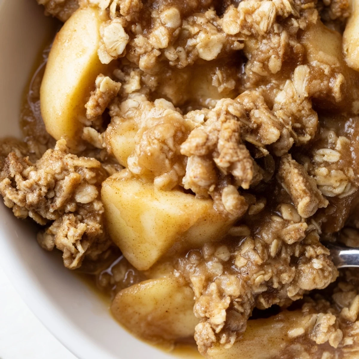 Tender cinnamon apples beneath a buttery crumb crust in this Crockpot Apple Crisp