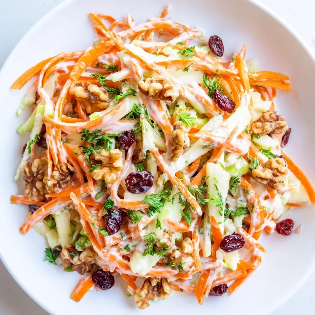 Crunchy Apple Carrot Salad With Creamy Citrus Dressing, bright orange carrots and tangy dressing