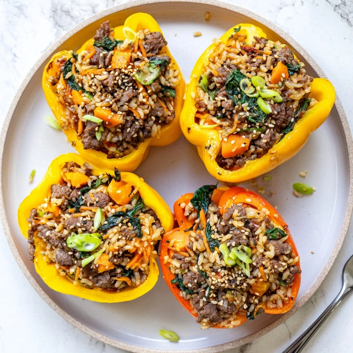 Vibrant bell peppers filled with savory bulgogi beef and fluffy rice mixture baked to tender perfection