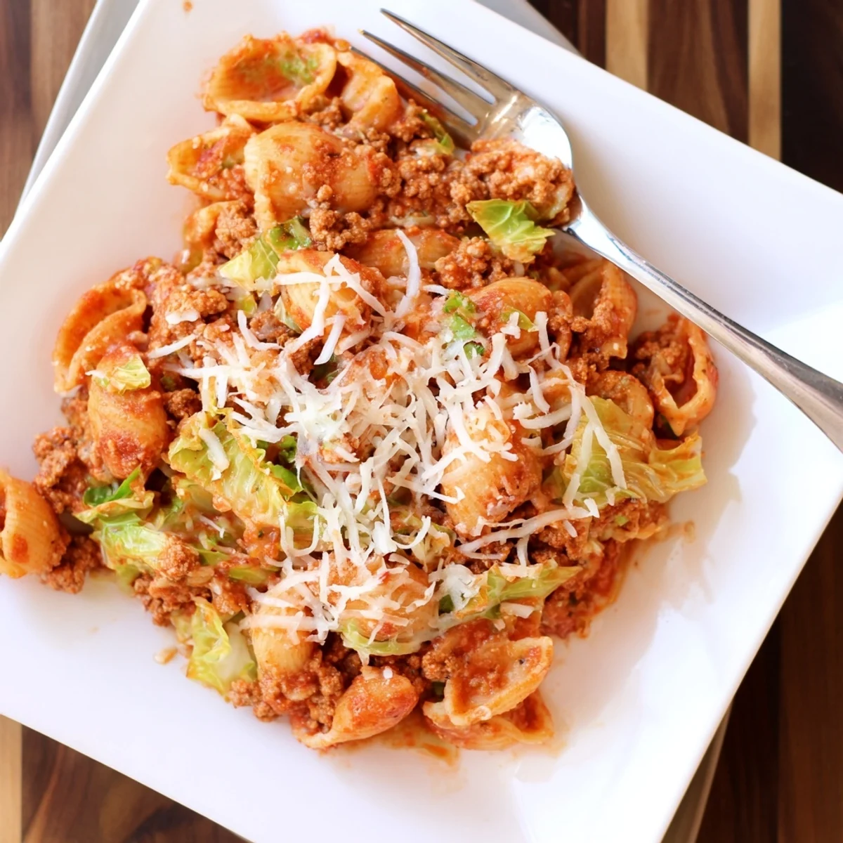 Cabbage roll pasta bake with bubbling mozzarella and ground beef in rich tomato sauce