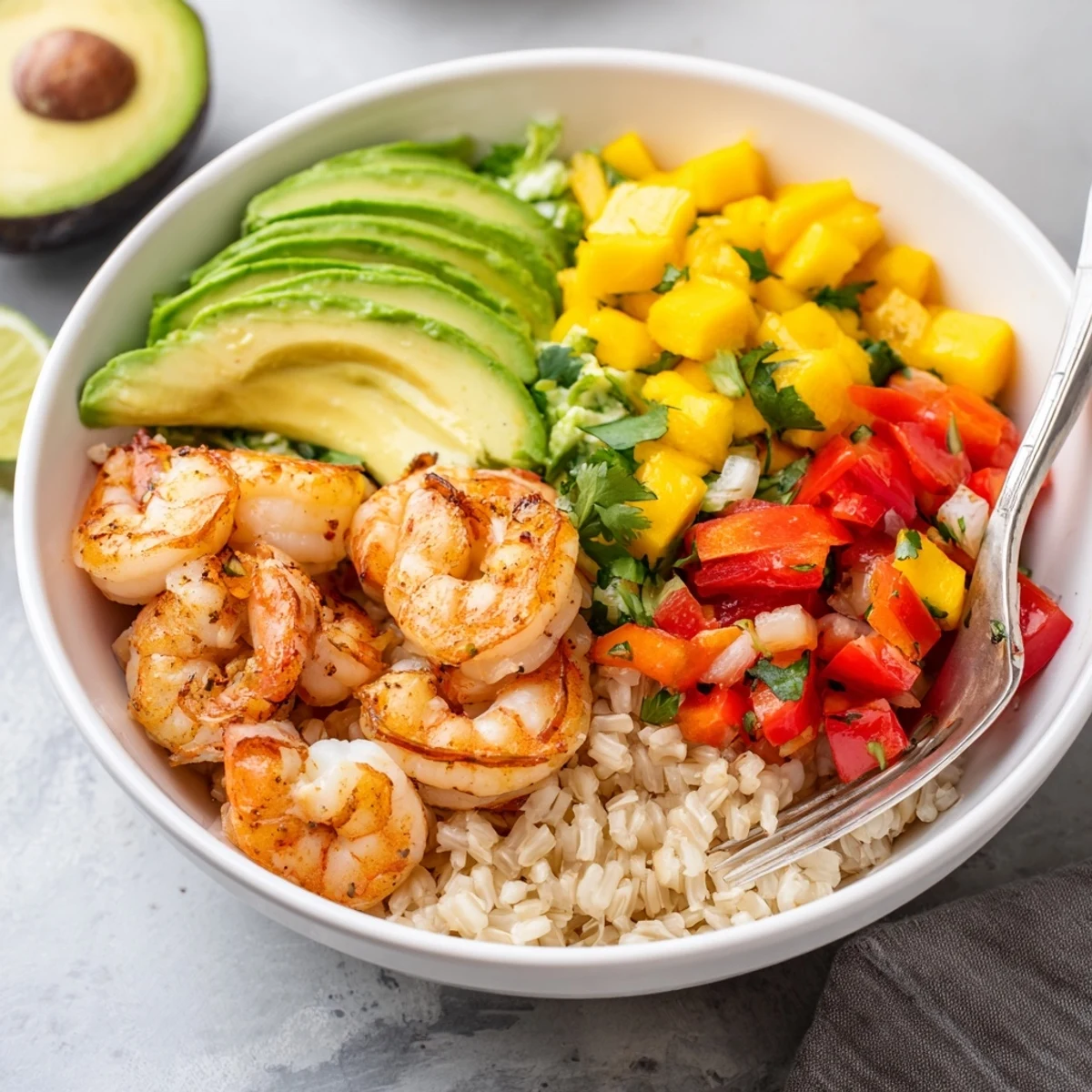 Juicy Shrimp And Avocado Bowls With Mango Salsa Lime Chili Sauce served over quinoa