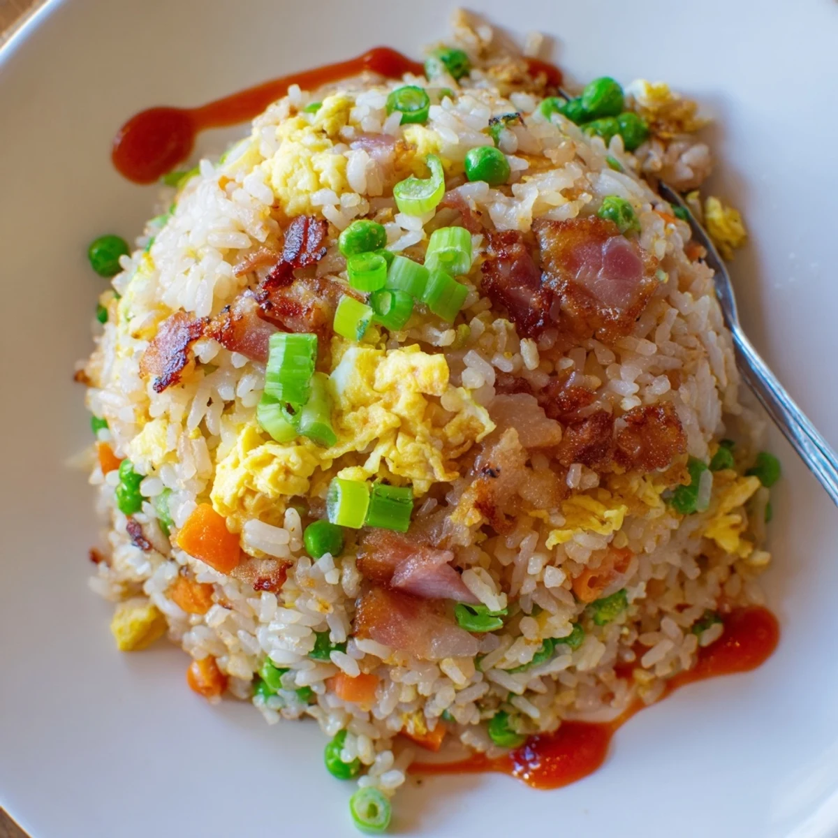 Hearty Breakfast Fried Rice piled on plate, soy-glazed grains, bright peas