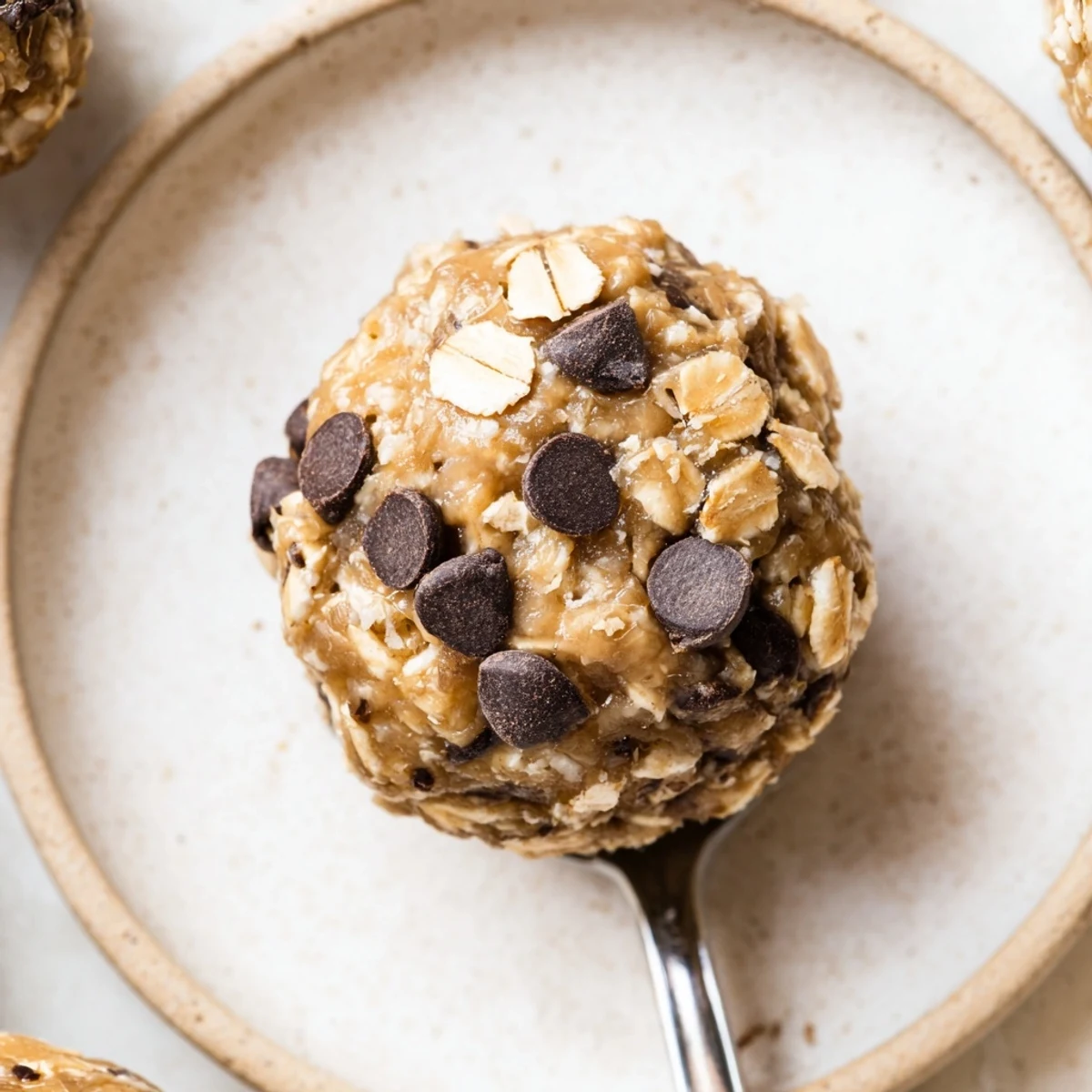 Homemade No Bake Energy Balls chilled in fridge, nutty aroma, satisfying bite  
