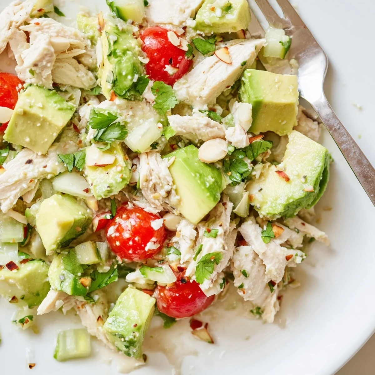 Avocado Chicken Salad with creamy avocado, juicy tomatoes, and zesty lime dressing