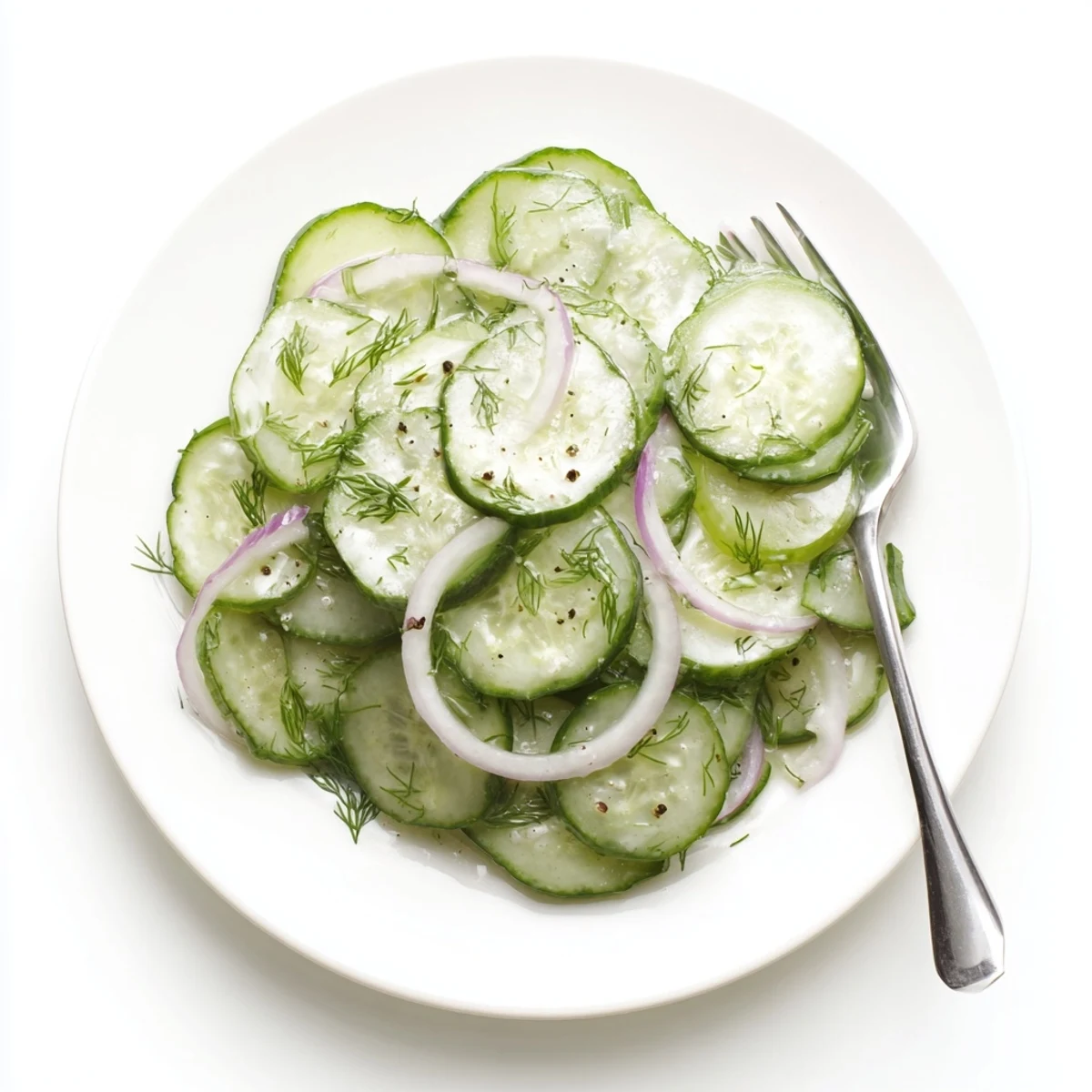 Bright Cucumber Salad tossed in tangy white wine vinaigrette, served cold.
