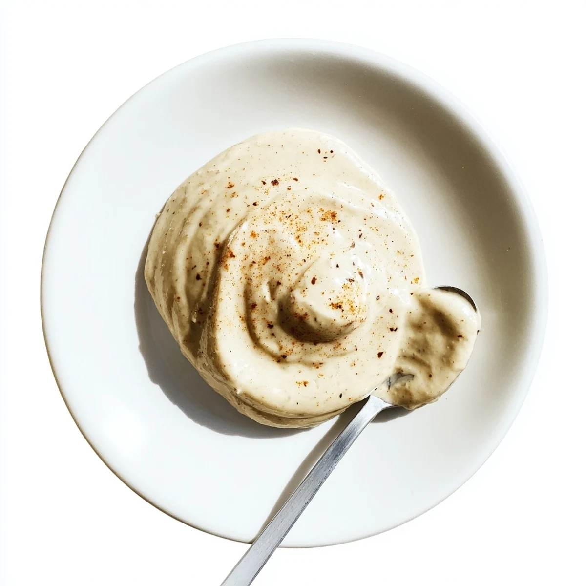 Golden roasted smoky garlic sauce served as a dipping spread with fresh vegetables on the side