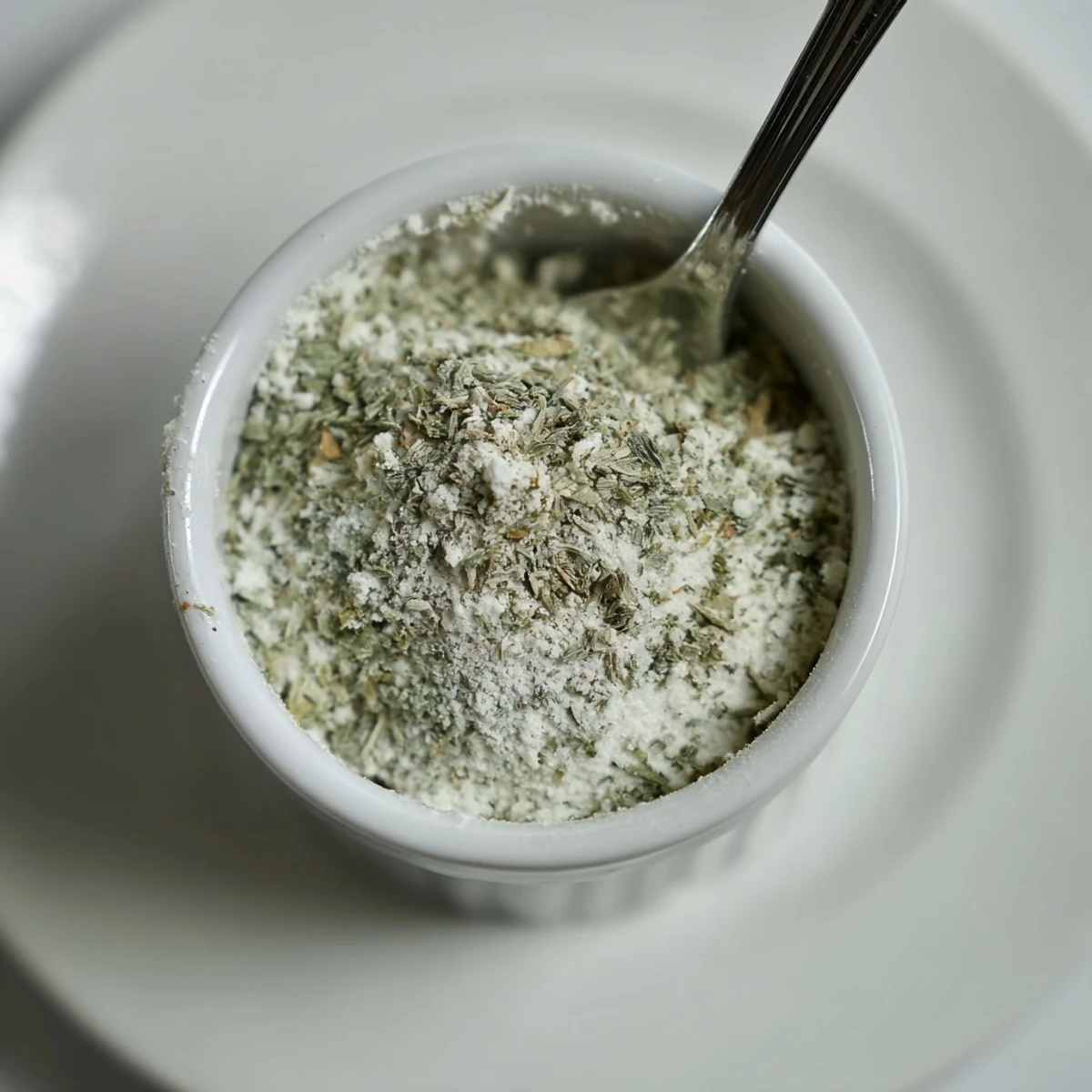 Spoonful of Dehydrated Tzatziki Seasoning Mix over creamy yogurt for dipping