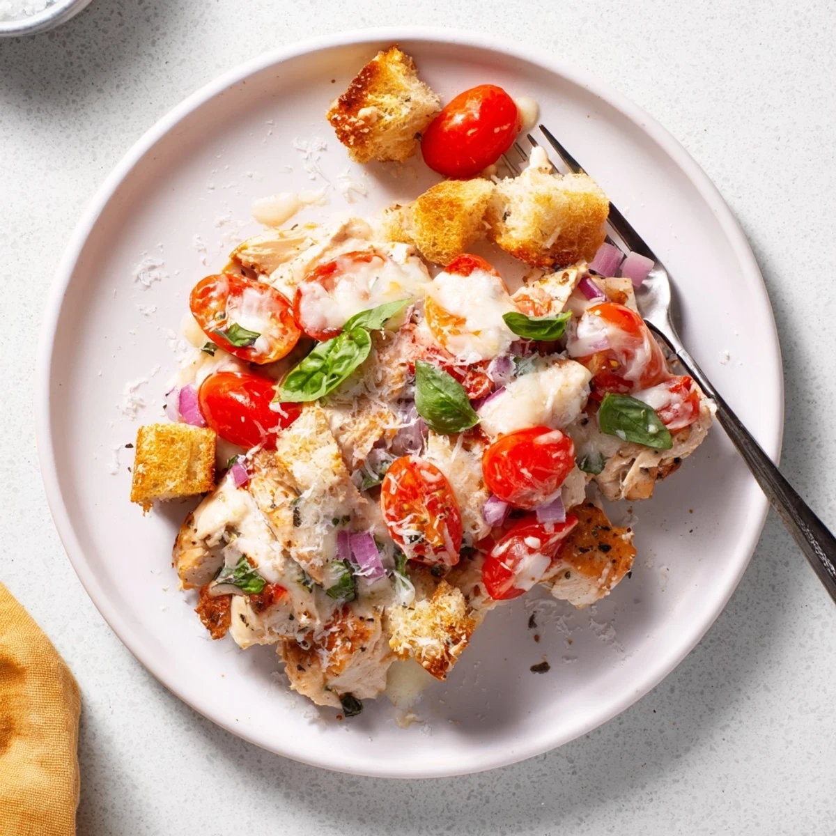 Steaming chicken bruschetta casserole with gooey cheese ripe tomatoes and fragrant garlic