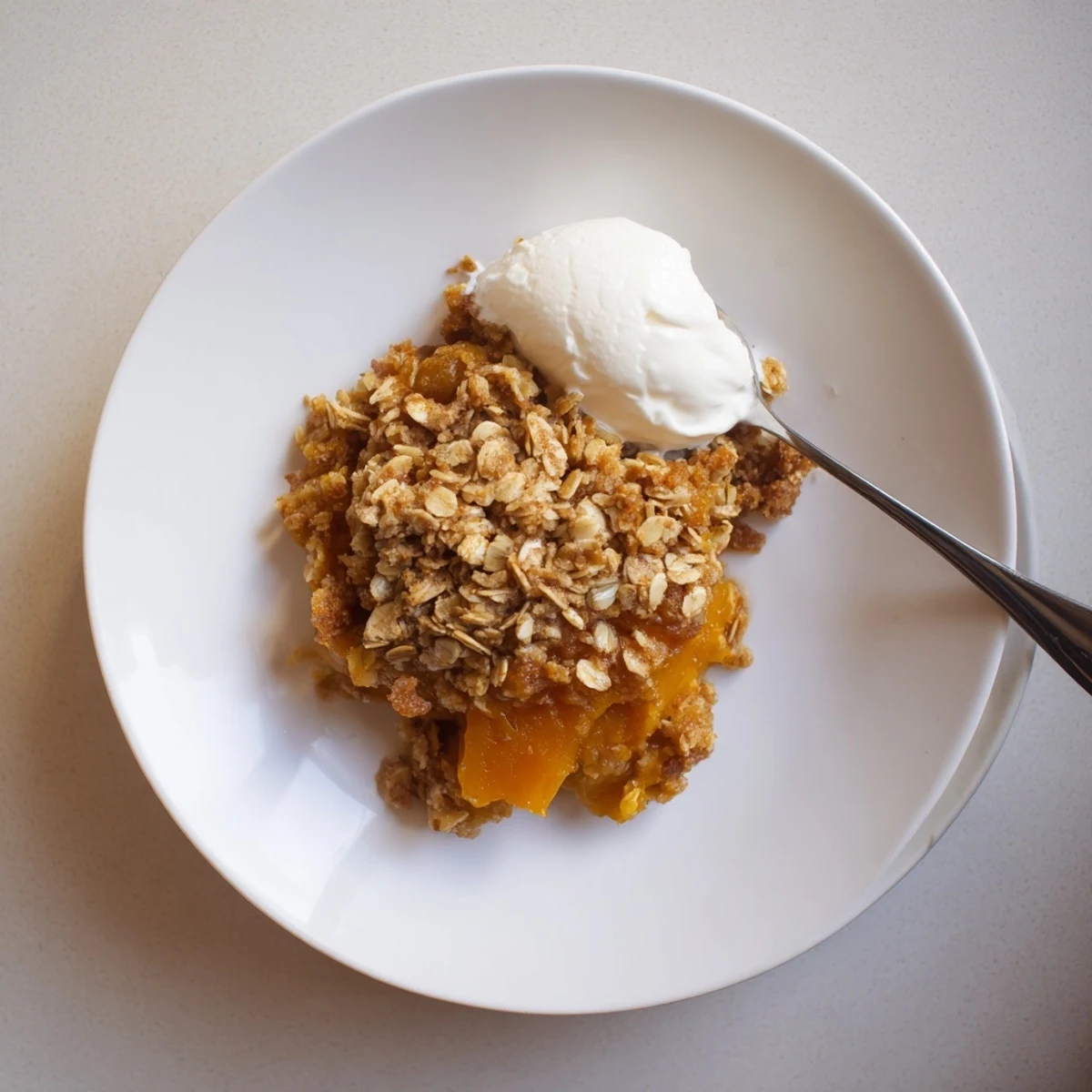 Creamy pumpkin pie crisp with golden oat crumble fresh from the oven