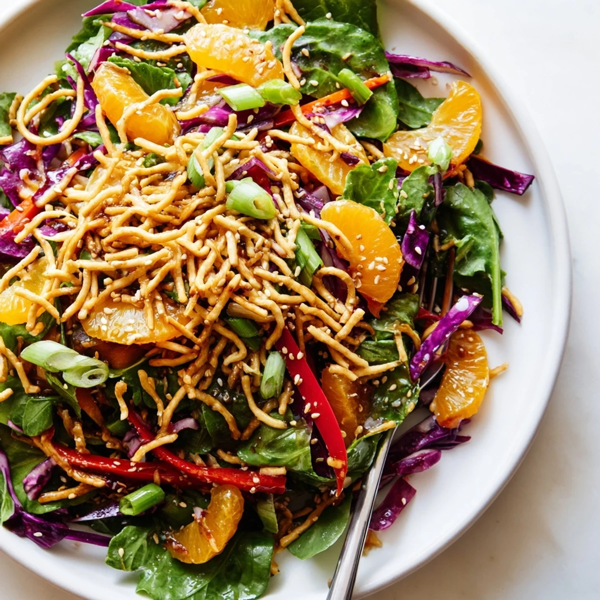 Colorful Mandarin Sesame Crunch Salad featuring crisp vegetables drizzled in tangy Asian dressing