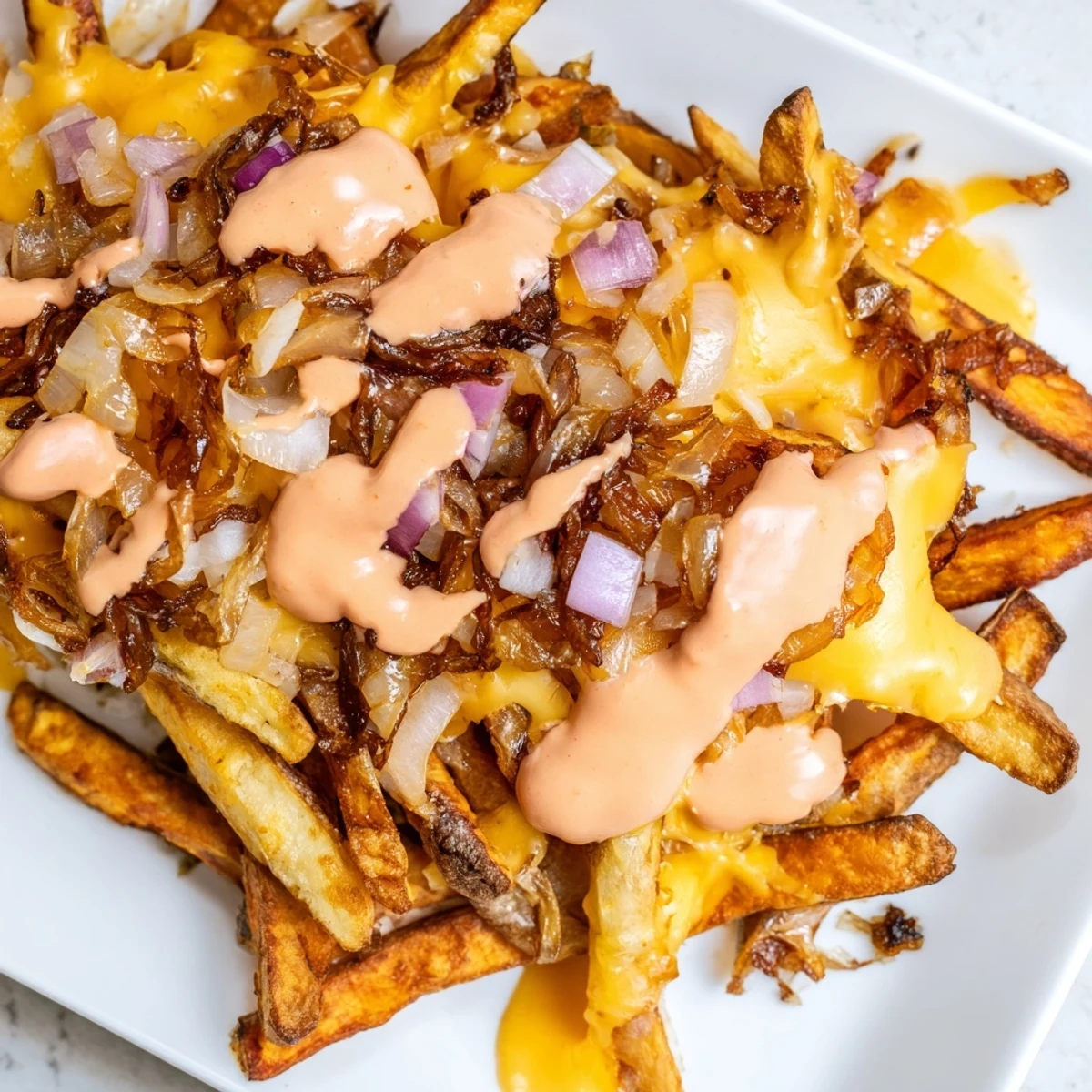 Crispy golden In-N-Out Animal Style Fries loaded with melted cheese and tangy sauce