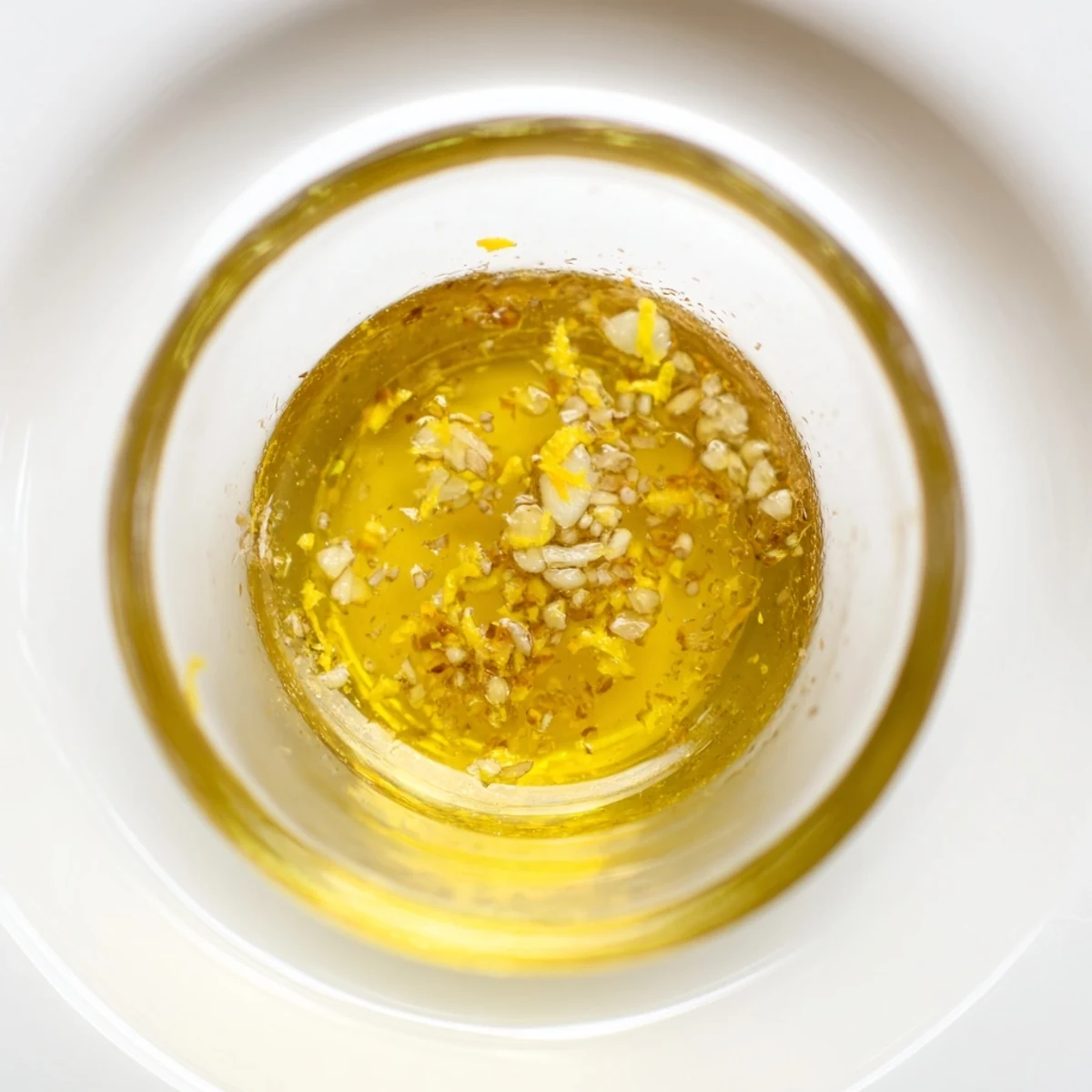 Zesty lemon vinaigrette dressing recipe served alongside grilled vegetables and chicken skewers