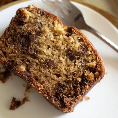 Freshly baked one bowl banana bread topped with rich chocolate chips